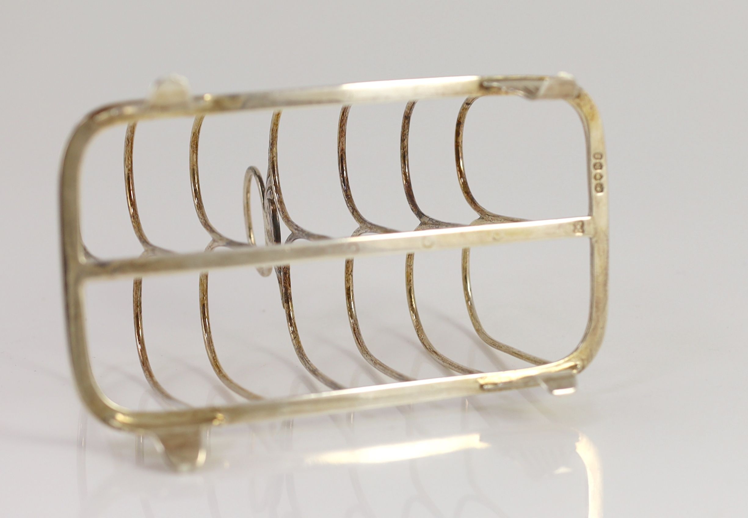 A William IV silver seven bar toastrack, by The Barnards